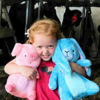 Baby girl taking her new friend Eleanor the cute blue stuffed bunny rabbit plush on a farm trip!